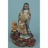 A Chinese porcelain figure of a lady