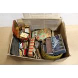 A collection of vintage matchbox tops housed in various vintage tins including a 1950's Noddy