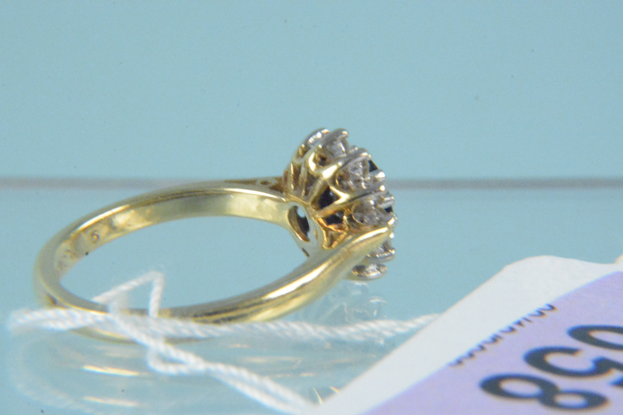 An 18ct gold sapphire and diamond cluster ring, - Image 3 of 3