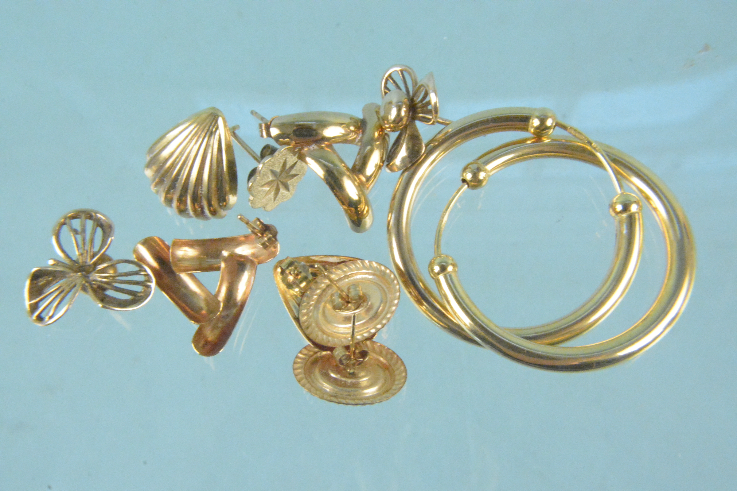 Five pairs of 9ct gold earrings, various designs,