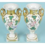 A pair of mid 19th Century continental porcelain vases with floral and gilded decoration and