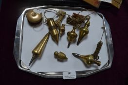 Seven Vintage Brass Plumb Bobs plus Brass Reel