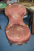 Victorian Carved Mahogany Nursing Chair with Burgundy Floral Pattern Upholstery