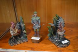 Two Cockerel Bookends and a Robin Hood Figure