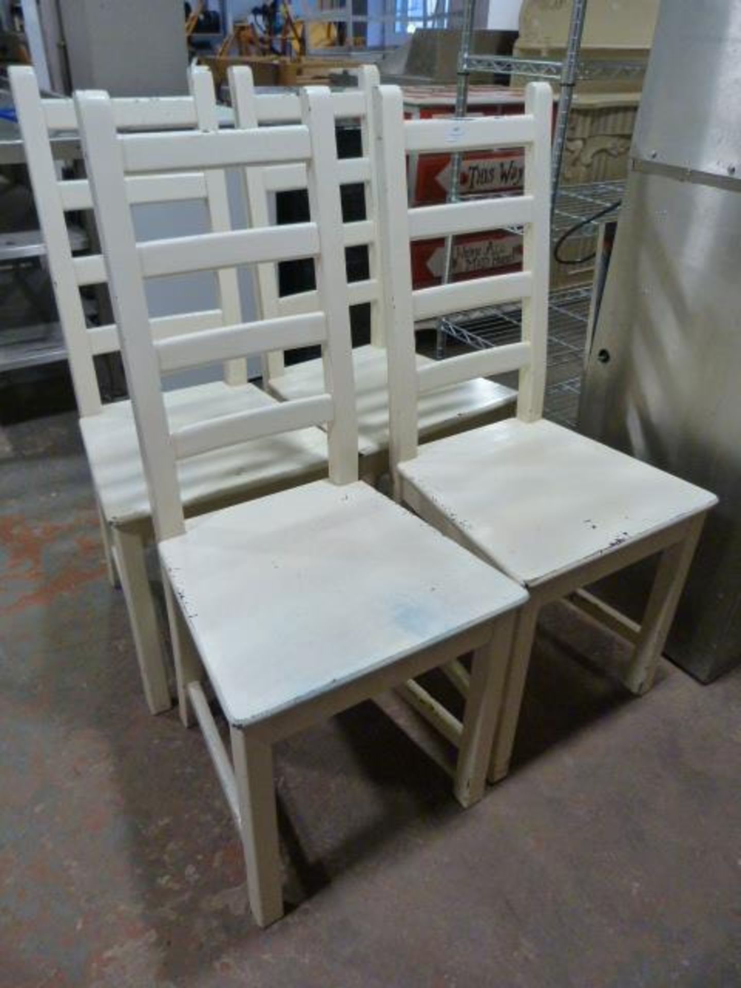 Four White Wooden Chairs