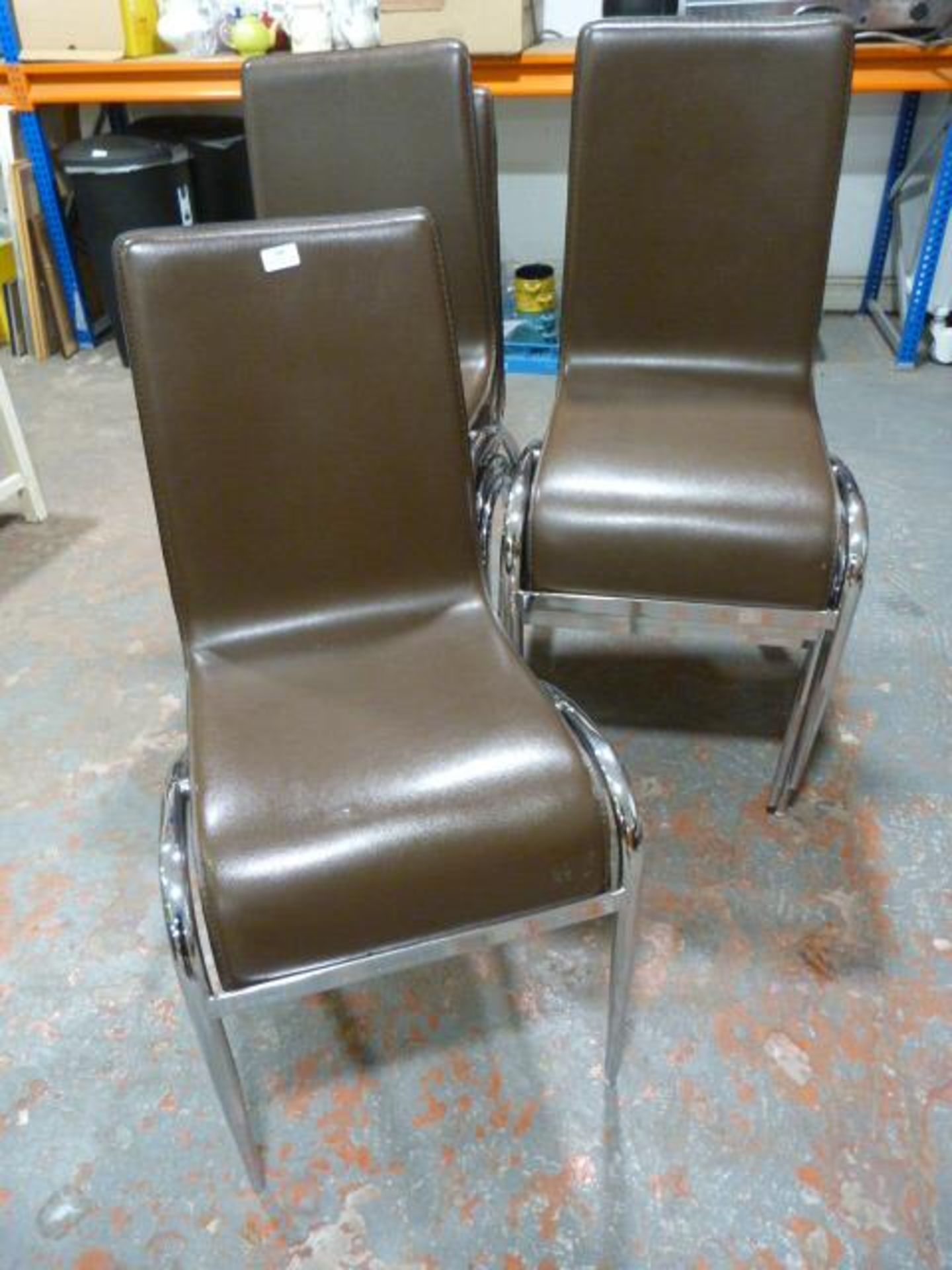 Seven Chrome Framed Upholstered Stacking Chairs