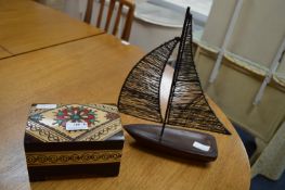 Wooden Casket and a Ship Ornament