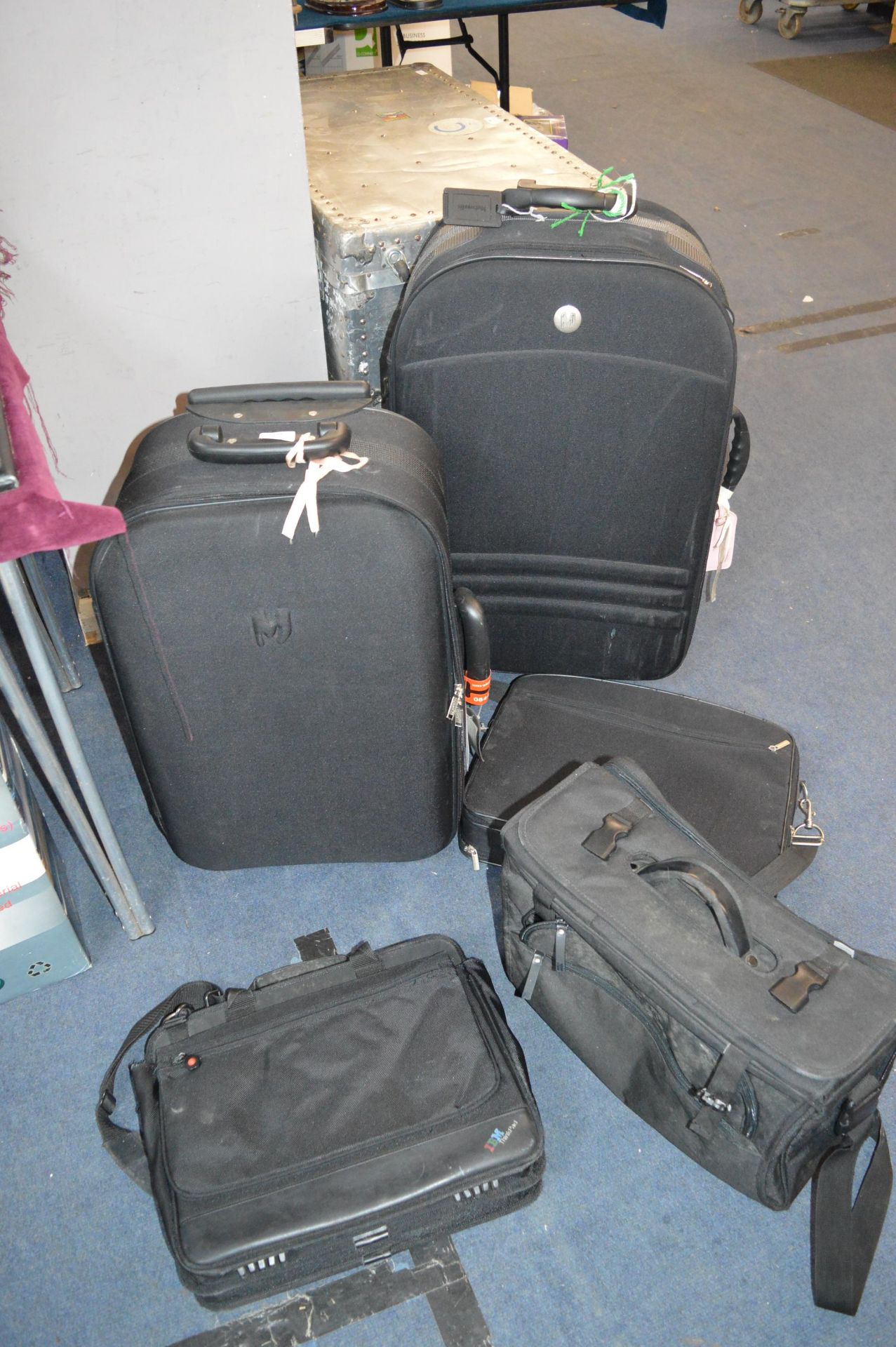 Two Black Suitcases plus Laptop Bags etc.