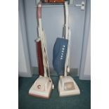 Two Hoover Vacuum Cleaners
