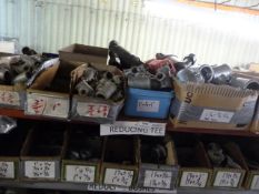 *Shelf of Various Threaded Pipe Fittings