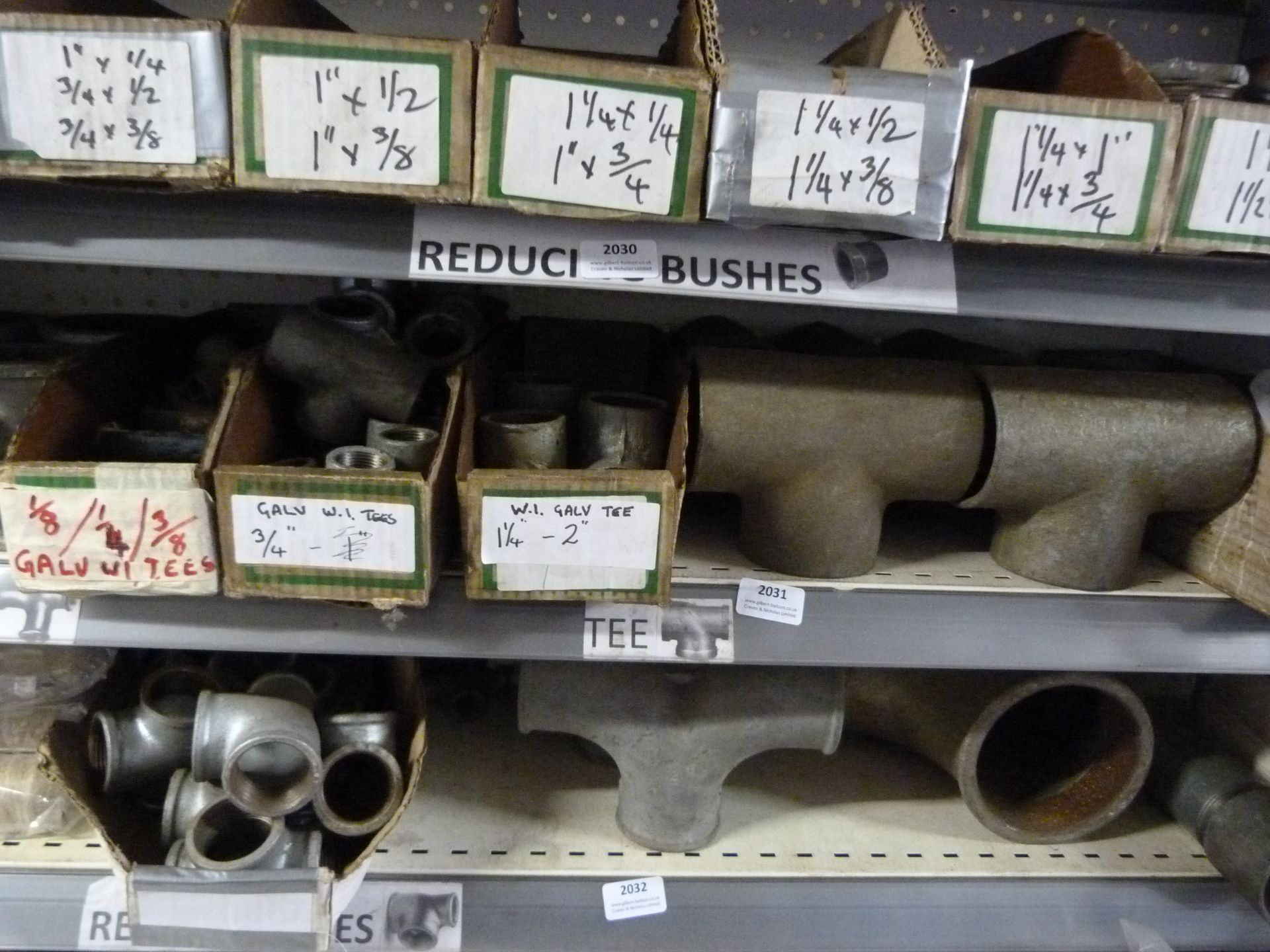 *Shelf of Various Pipe Fittings, T-Sections, etc.