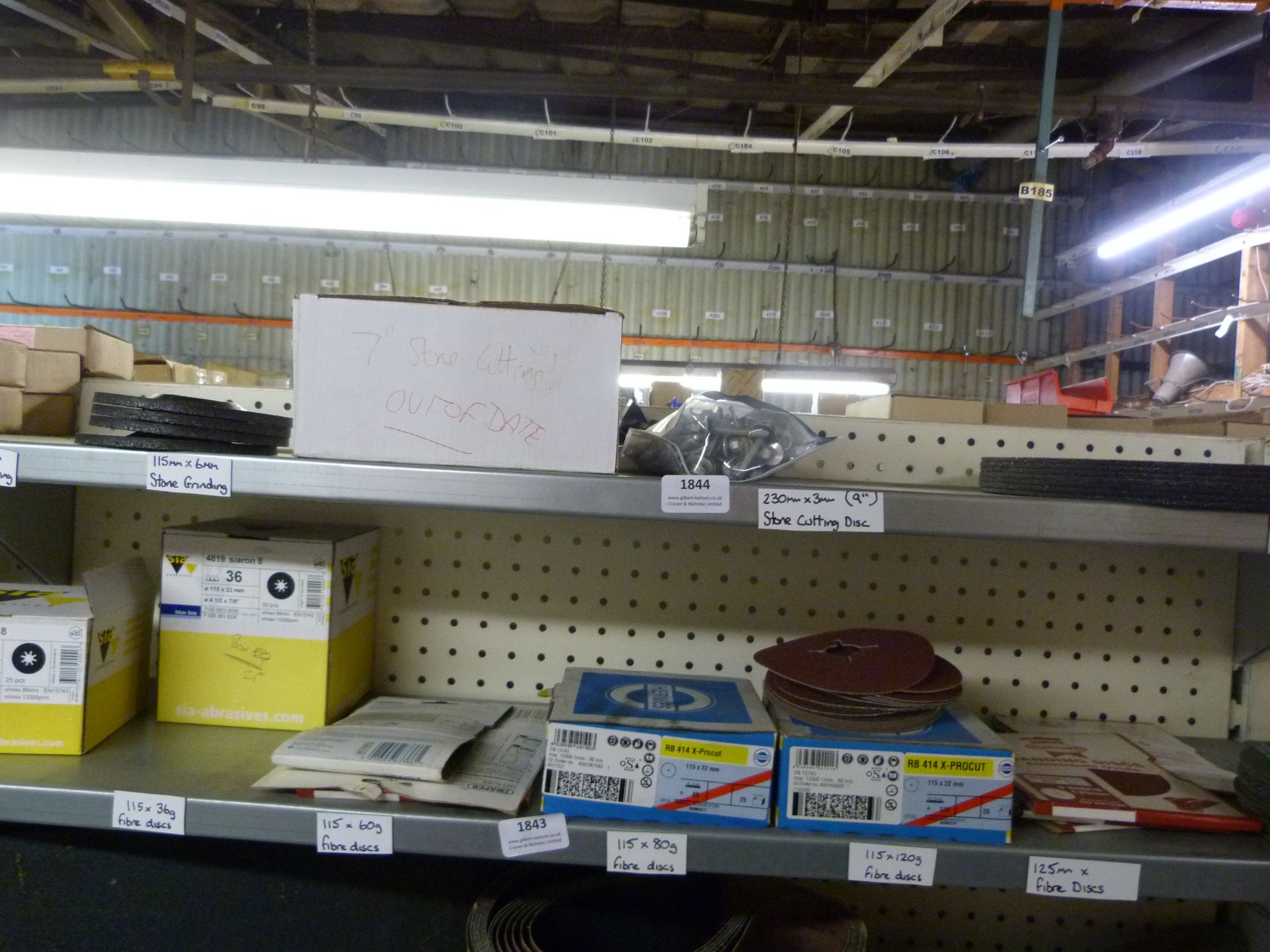 *Shelf of Various Abrasive Wheels, Cutting Stones, etc.