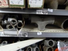 *Shelf of Various Pipe Fittings, T-Sections, etc.