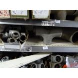 *Shelf of Various Pipe Fittings, T-Sections, etc.