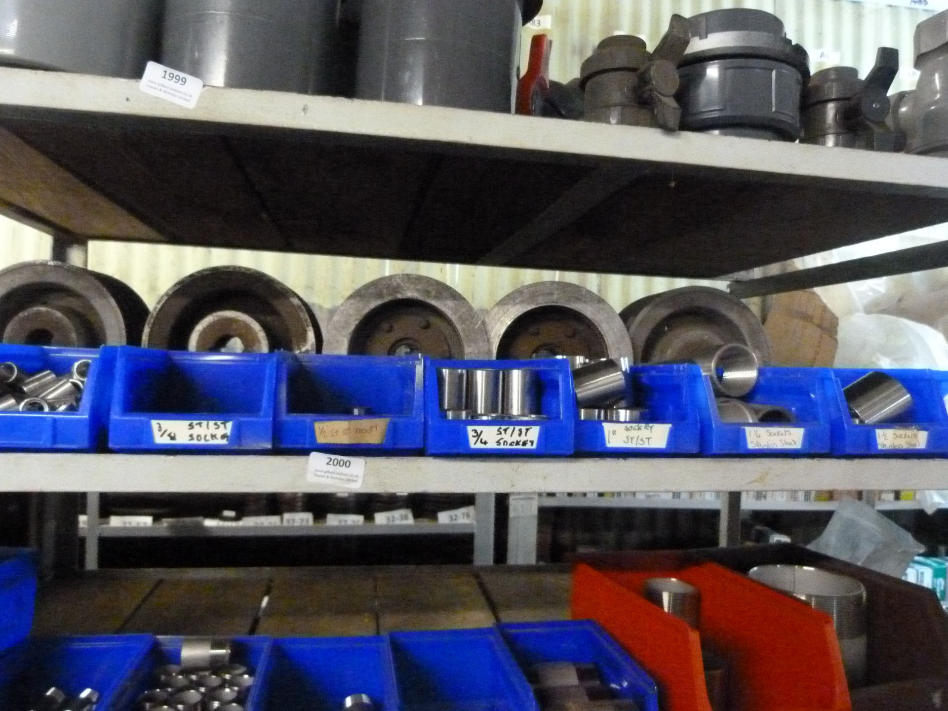 *Shelf of Various Stainless Steel Threaded Pipe Fittings