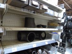 *Four Shelves of Various Pipe Elbows, Crossroad Pieces, T-Pieces, etc.