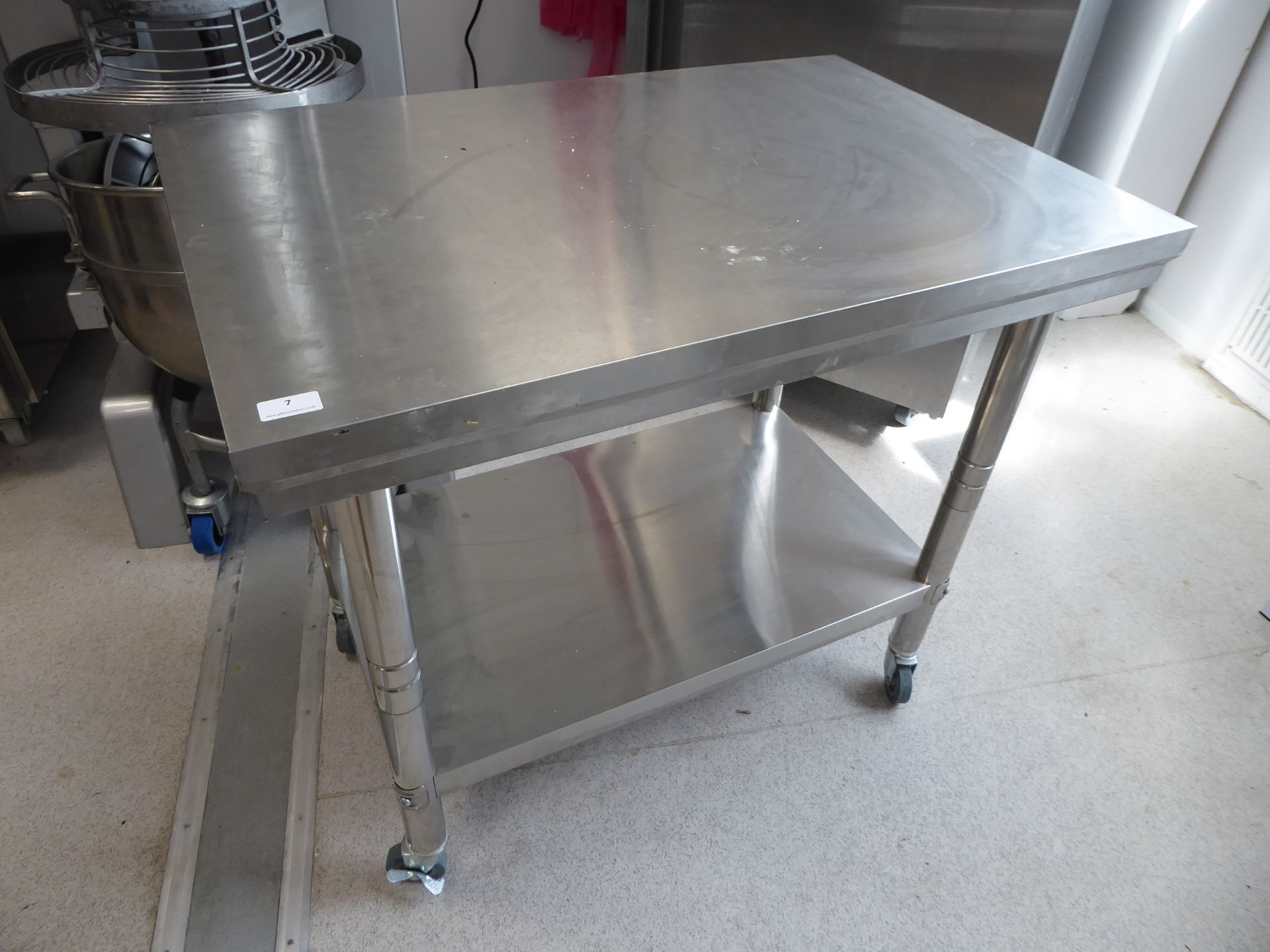 * S/S bench on castors with undershelf. 900w x 600d x 800h