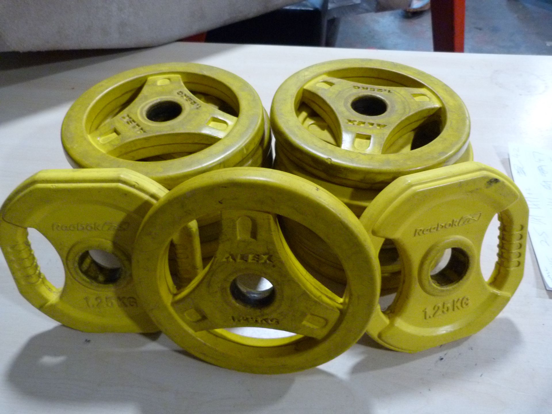 *Thirteen Alex 1.25kg Weight Discs (yellow), and Two Reebok 1.25kg Weights