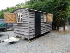 Shepherds Hut Cladded in Wavy Edge Larch with Corrugated Tin Roof