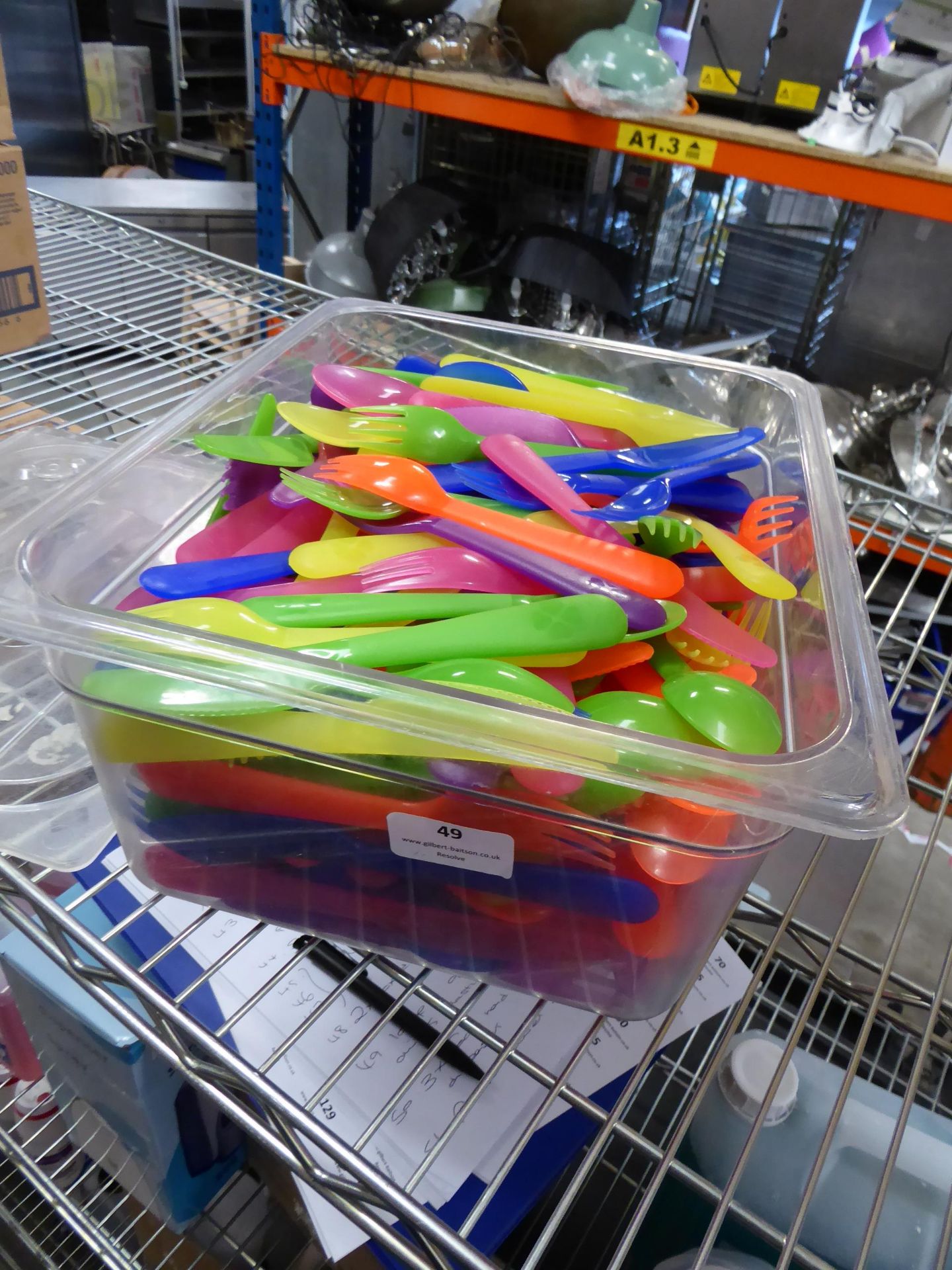 * large quantity of plastic childrens cutlery