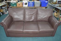 Brown Leatherette Three Seat Sofa Bed