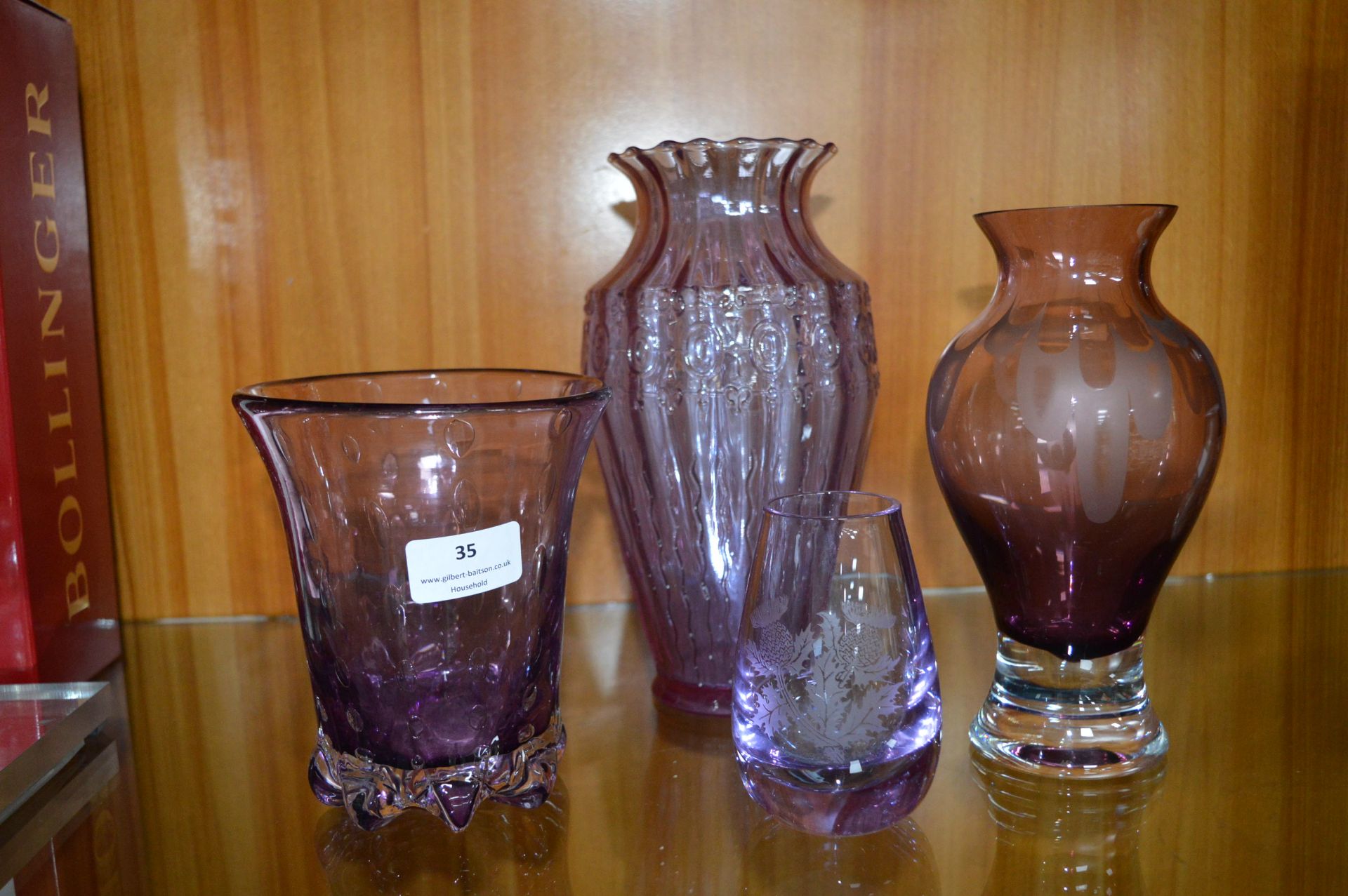 Four Purple Glass Vases
