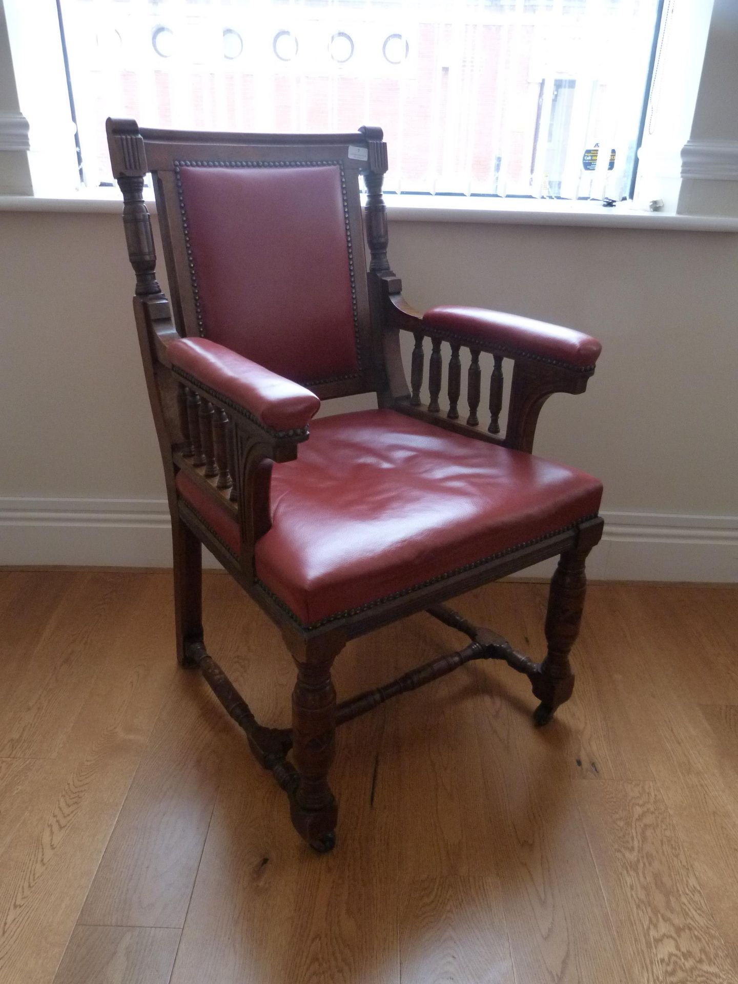 *Victorian Armchair on Bobbin Legs and Castors with Red Leather Upholstery