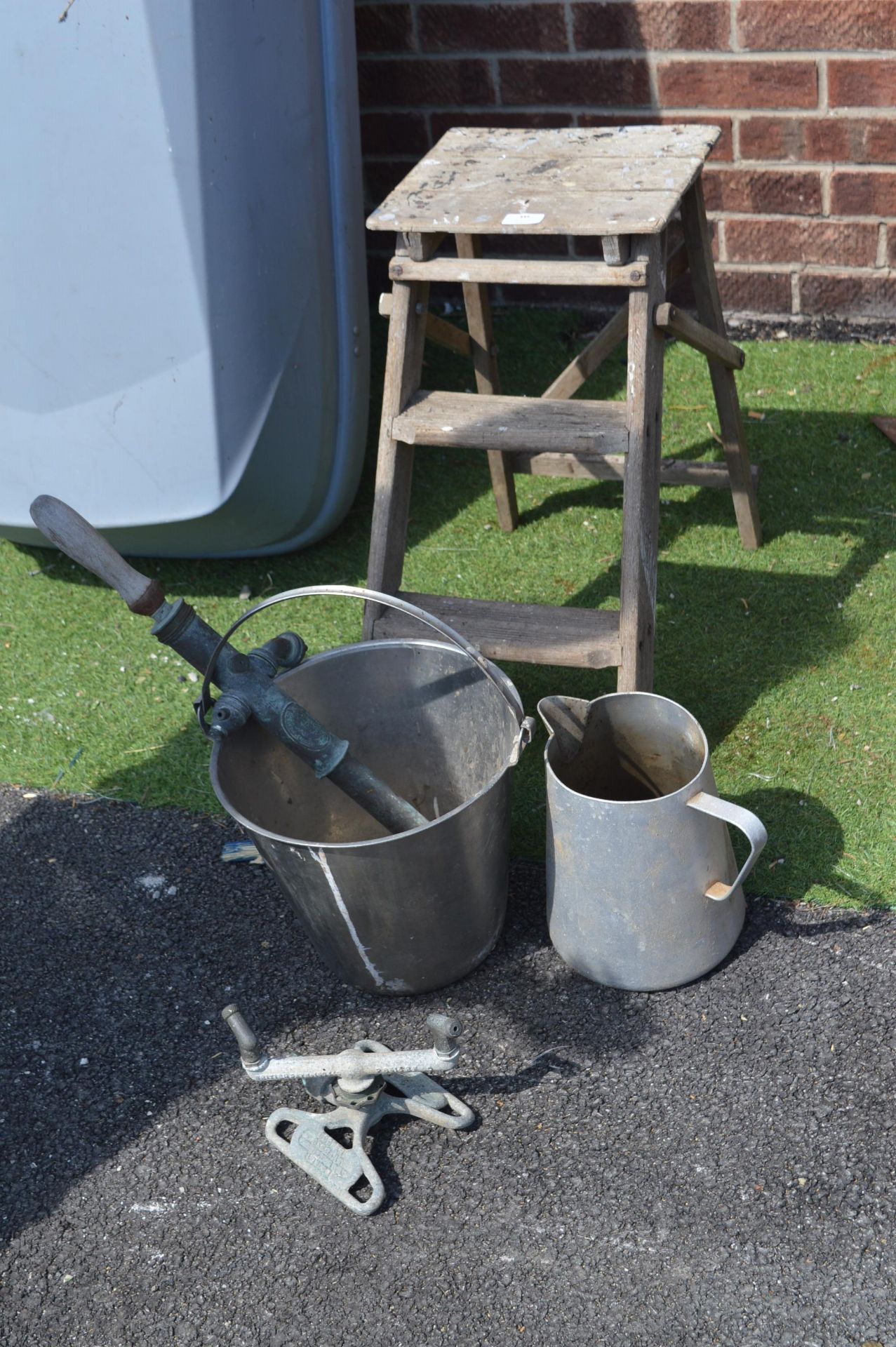 Wooden Stool, Vintage Garden Pump, and a Water Spr