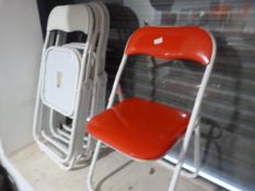 *Six White Tubular Framed Folding Chairs with Coloured Upholstery