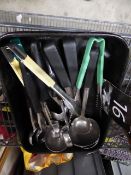 * selection of ladles and tongs