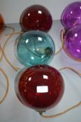 Two Red and One Blue Glass Pendant Lamps