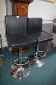 *Pair of Black Gas-Lift Barstools