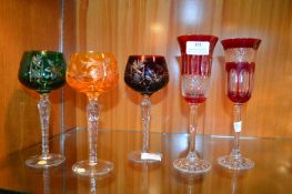 Two Cranberry Wine Glasses and Three Hock Glasses