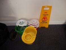 *Three Mop Buckets and a Wet Floor Sign