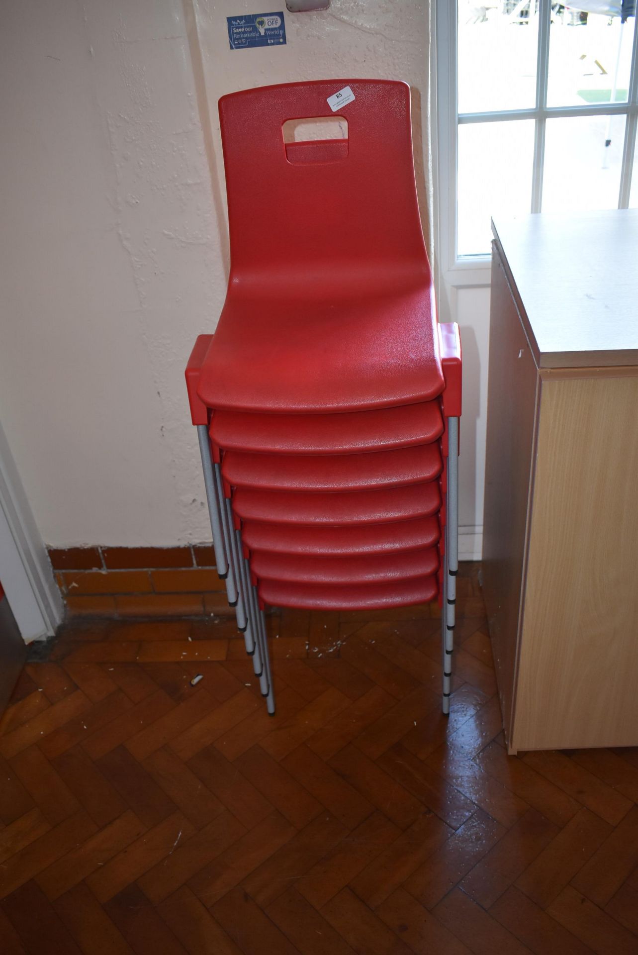 *Seven Red Stackable Chairs