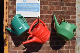 *Three Watering Cans