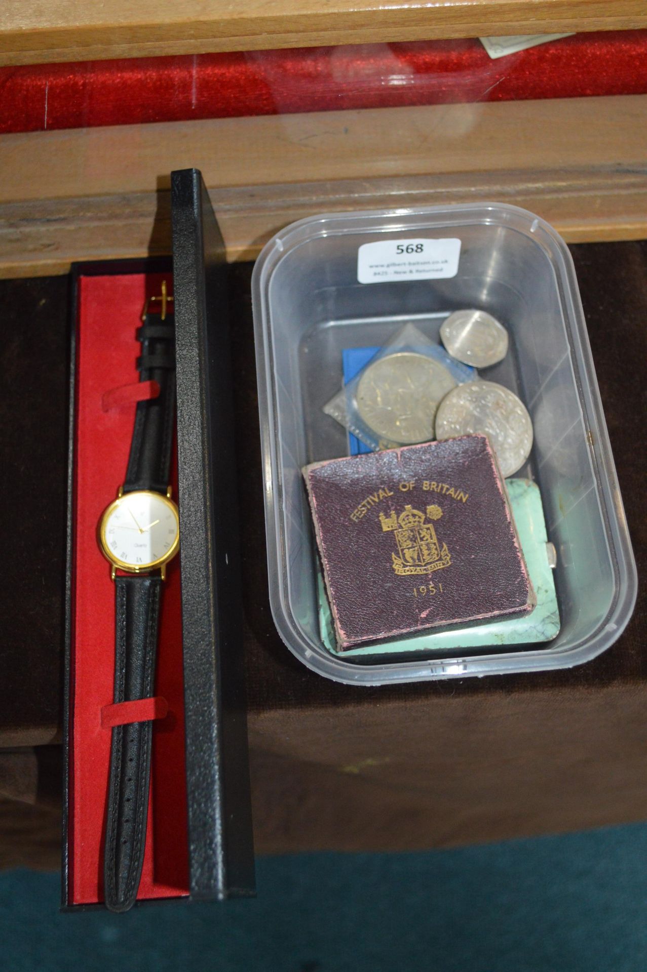 Coins, Medallions, Cigarette Case, and a Wristwatc