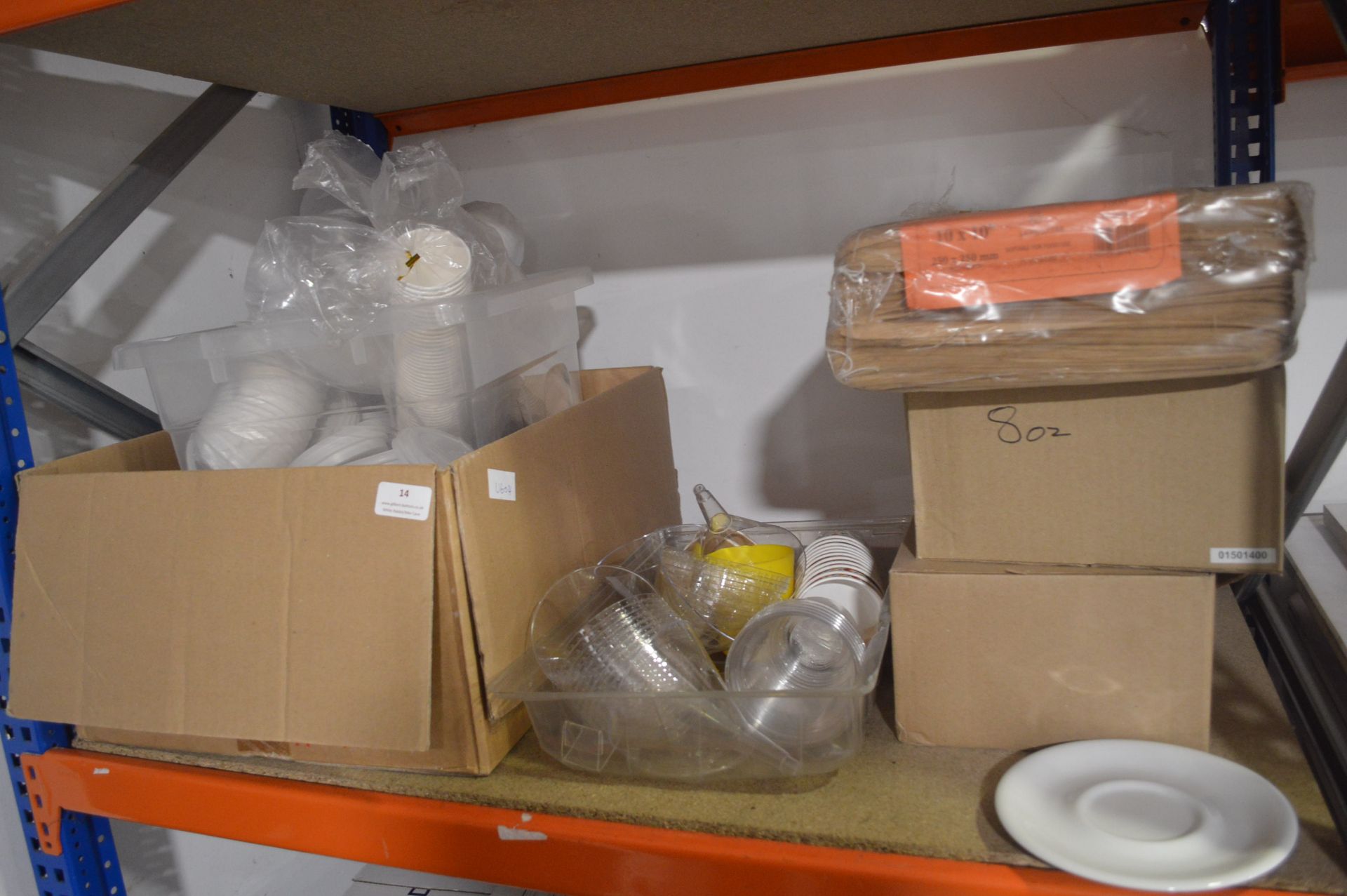 *Shelf of Disposable Cups, Two Boxes of Saucers, a