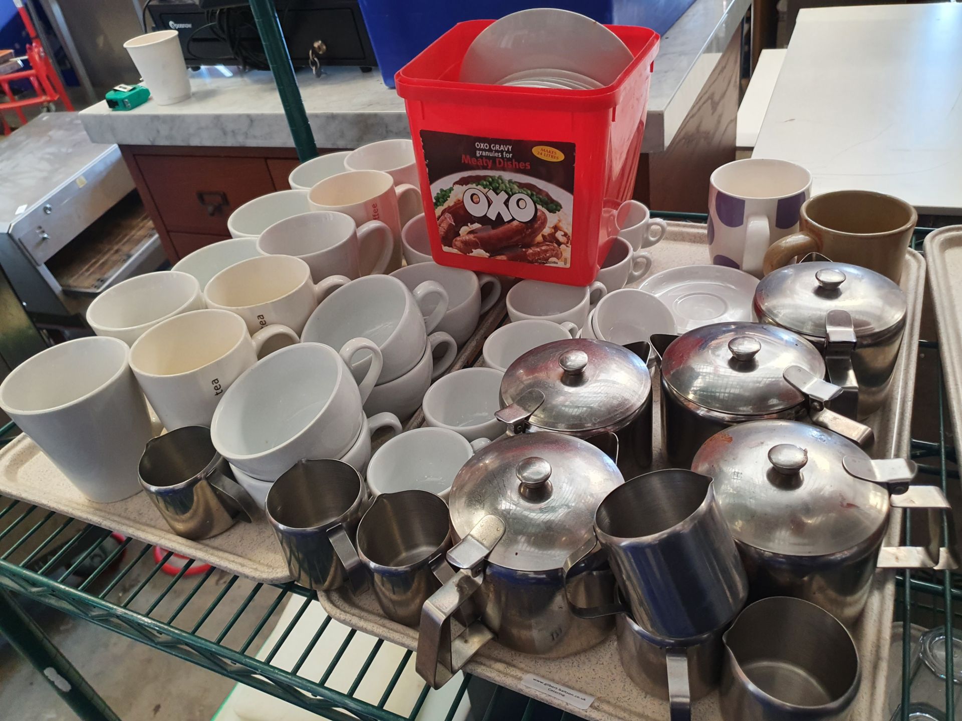 * selection of mugs, saucers and tea pots
