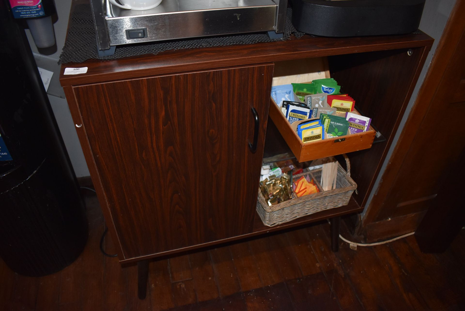 *Simulated Rosewood Storage Cupboard Containing Assorted Teas, Disposable Products, Cleaning