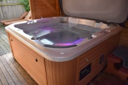 *System Wash Leisure 6 Person Hot Tub with LED Lighting, Audio System, Insulated Cover, Access Steps