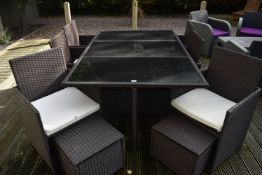 *Rattan Patio Set Comprising Glass Topped Table, Six Chairs, and Footstools