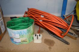 Orange Extension Lead on Reel and Garden Edging