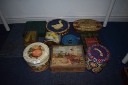 Eight Vintage Tins and a Candle Holder