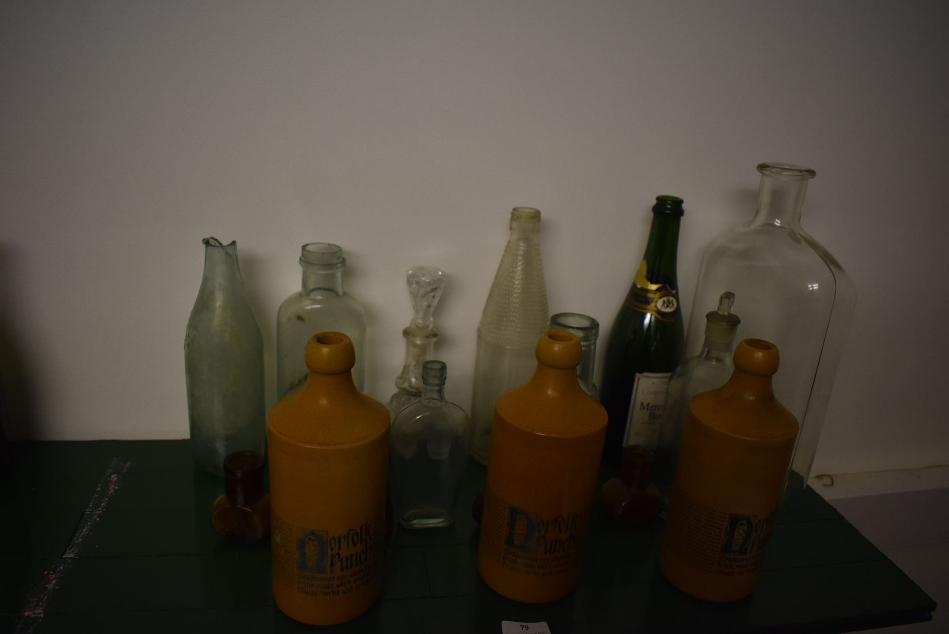 Collection of Glass Bottles and Three Norfolk Punch Stoneware Bottles