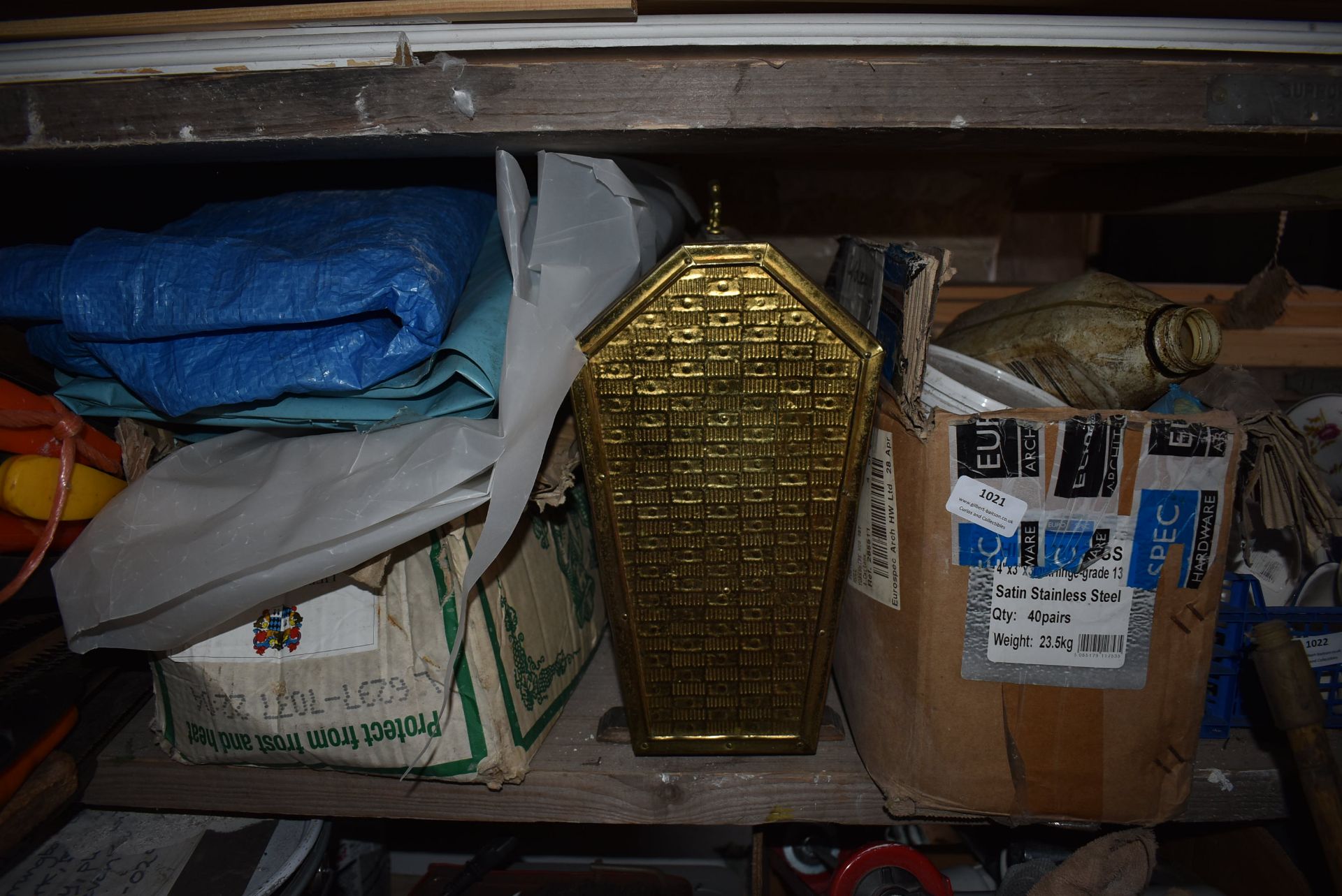 Shelf Containing Box of Candles, Newspaper Rack, etc.