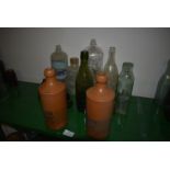 Collection of Glass Bottles and Two Norfolk Punch Stoneware Bottles
