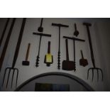 Items on Wall; Three Wooden Mallets, Three Taps, Two Forks, and a Rubber Hammer