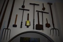 Items on Wall; Three Wooden Mallets, Three Taps, Two Forks, and a Rubber Hammer