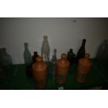 Collection of Glass Bottles and Three Norfolk Punch Stoneware Bottles